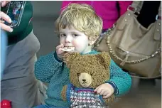  ??  ?? Edmund Fanning, 3, enjoys his sandwich.