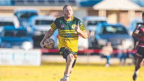  ?? Picture: Kevin Farmer ?? IN THE CLEAR: Aaron Hooper races away for the third of his tries for the Wattles Warriors against Valleys in the TRL on Sunday.