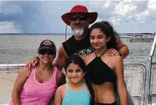  ?? Courtesy Rosalva Mendez ?? From left, Rosalva Mendez with her husband Mark and their daughters Vivian and Sophia at Miramar Beach in Florida in 2019. The San Antonio family normally travels several times a year but has made trips only to the Texas coast since the COVID-19 pandemic.