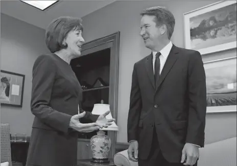  ?? JOSE LUIS MAGANA/AP PHOTO ?? Sen. Susan Collins, R-Maine, speaks with Supreme Court nominee Judge Brett Kavanaugh at her office Tuesday before a private meeting on Capitol Hill in Washington, D.C.