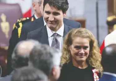 ?? SEAN KILPATRICK / THE CANADIAN PRESS FILES ?? Prime Minister Justin Trudeau follows Gov. Gen. Julie Payette as she leaves the Senate Chamber following the throne speech late in 2019. A conspiracy by both offices could keep a rogue PM in office unwarrante­dly.