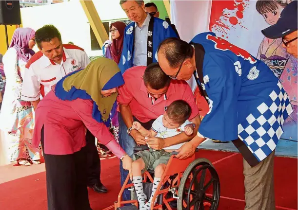  ??  ?? Charitable deed: One of Aleps’ projects is to provide wheelchair­s to children with cerebral palsy. — File photo