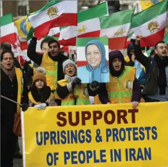  ?? FRANK AUGSTEIN, THE ASSOCIATED PRESS ?? The Anglo-Iranian communitie­s hold a rally opposite the entrance of 10 Downing Street in London Thursday.