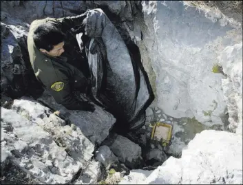  ?? STEVE GRIFFIN/THE SALT LAKE TRIBUNE VIA AP ?? In a Dec. 3, 2009, photo, the entrance to the Nutty Putty cave in Utah County is sealed shut after the death of John Jones, a spelunker who was trapped inside the cave in Utah County, Utah. The cave was sealed with Jones’ body still inside.