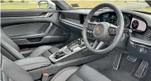 ??  ?? The 911’s interior is attractive­ly simple and almost brutally sensible in its layout.