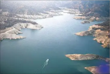  ?? Robert Gauthier
Los Angeles Times ?? RINGS show the low water level in June at Castaic Lake, part of the State Water Project. Sen. Dianne Feinstein said a bill she introduced Thursday addresses California’s long-term and short-term water concerns.