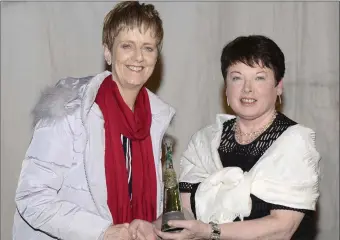  ??  ?? Ann Flannery of Letterkenn­y Music and Drama Group receives the trophy for the ‘most imaginativ­e production’ of the play ‘Beneath an Irish Sky’ by Kieran Kelly.