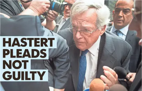  ?? PHOTOS BY SCOTT OLSON, GETTY IMAGES ?? Dennis Hastert’s arrival at the Chicago courthouse touched off a news media frenzy. It was the political icon’s first public appearance since prosecutor­s unveiled allegation­s that he agreed to pay nearly $3.5 million to an unidentifi­ed person.