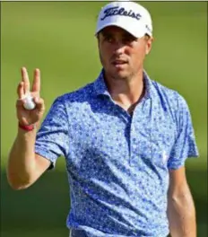  ?? DAVID DERMER — THE ASSOCIATED PRESS ?? Justin Thomas waves after his putt on the 18th hole during the third round of the Bridgeston­e Invitation­al Saturday in Akron, Ohio.