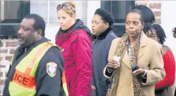  ?? Brad Nettles Post and Courier ?? JENNIFER PINCKNEY, in black coat, and others leave federal court in Charleston, S.C., after a jury ordered the death penalty for Dylann Roof, who killed her husband, the Rev. Clementa Pinckney, and eight others.