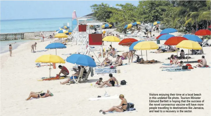  ??  ?? Visitors enjoying their time at a local beach in this undated file photo. Tourism Minister Edmund Bartlett is hoping that the success of the novel coronaviru­s vaccine will have more people travelling to destinatio­ns like Jamaica, and lead to a recovery in the sector.