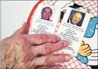  ?? Christian Abraham / Hearst Connecticu­t Media ?? Rose DeVito shows funeral cards for her husband and son at her home in Darien on Feb. 24. Rose lost her husband Anthony DeVito Jr. from COVID-19 at age 92 and her son Jack died from COVID-19 as well at age 60.