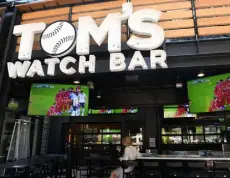  ?? Helen H. Richardson, Denver Post file ?? Tom’s Watch Bar, the official bar of the Colorado Rockies, features three Topgolf Swing Suites with various virtual games from golf to hockey and baseball.