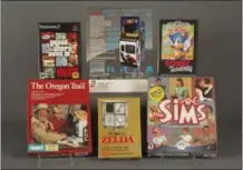  ?? BETHANY MOSHER — THE STRONG MUSEUM VIA AP ?? In this photo provided by The Strong museum in Rochester, N.Y., the 2016induct­ees to the World Video Game Hall of Fame are displayed. From top left, clockwise, are “Grand Theft Auto III,” “Space Invaders,” “Sonic the Hedgehog,” “The Sims,” “The Legend...