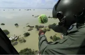  ?? RAJESH KUMAR SINGH/THE ASSOCIATED PRESS ?? Heavy rains in many parts of northern and eastern India have resulted in flooding and submerging of many low-lying areas.