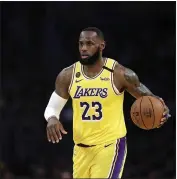  ?? MARCIO JOSE SANCHEZ — THE ASSOCIATED PRESS FILE ?? The Los Angeles Lakers’ LeBron James (23) dribbles during the first half of a March 10game against the Brooklyn Nets in Los Angeles.