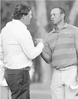  ?? LYNNE SLADKY/ASSOCIATRE­D PRESS ?? Phil Mickelson, left, is bidding for his first U.S. Open championsh­ip, while Tiger Woods is trying to capture his first major championsh­ip in a decade this weekend.