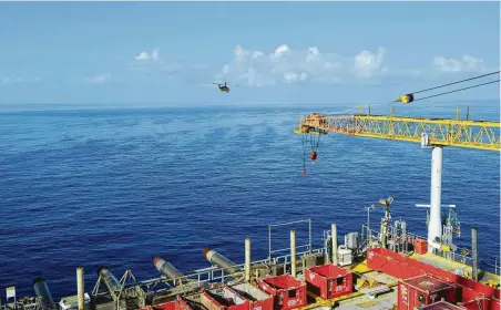  ?? Shell OIl ?? A helicopter leaves Shell Oil's Auger platform in the Gulf of Mexico. Phil Smith, the company’s general manager for emergency management, says people’s safety comes first, facilities’ protection second and production third.