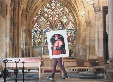  ?? PICTURES: SIMON HULME. ?? HOLY FITTING: A reproducti­on of a painting of Cardinal Wolsey is carried into Mary’s Church in Beverley for the new exhibition.