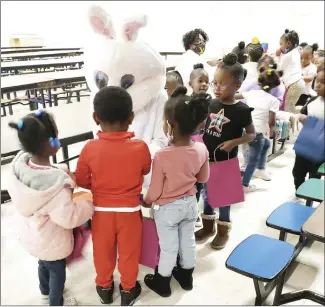  ?? Submitted Photo ?? Cornerston­e M.B. Church of Madison recently visited the ABC School to give Easter gifts to children, who also enjoyed a visit from the Easter bunny. Each child received a bag containing candy and a toy as part of the church’s community outreach program.