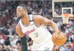  ??  ?? Miami Heat guard Dwyane Wade controls the ball against the Philadelph­ia 76ers during the second half at American Airlines Arena in this Feb 27 file photo. — USA TODAY Sports photo