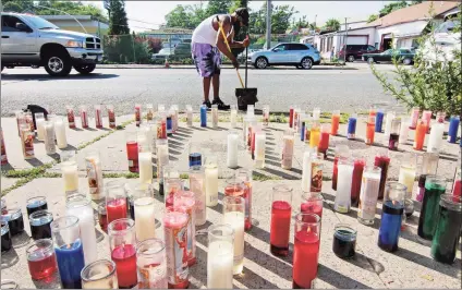  ?? Christian Abraham / Hearst Connecticu­t Media ?? A file photo of a memorial set up for Eugene Stinson, 18, in Bridgeport. He was fatally shot on June 23.