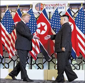  ?? The New York Times/DOUG MILLS ?? President Donald Trump and North Korean leader Kim Jong Un start their nuclear arms negotiatio­ns with a handshake Wednesday in Hanoi, Vietnam.