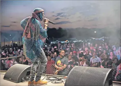  ??  ?? Bring your fire:
As acts such as
Swati singer Sands (above) and Timbila Muzimba from Mozambique (right) ignited the Bushfire crowds, local queer rights activist Pinty Dludlu (left) said the liberal nature of the festival gave her hope that the...