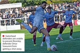  ?? ?? ■ Gateshead defenders are unable to prevent Bromley defender Omar Sowunmi from getting a shot away.