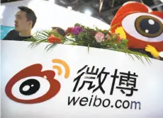  ?? Mark Schiefelbe­in / Associated Press ?? Staffers of Sina Weibo promote the site at the Global Mobile Internet Conference in April in Beijing. Three Chinese Internet services have been ordered to stop streaming video.