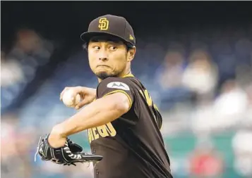  ?? MANUEL BALCE CENETA AP ?? Padres starting pitcher Yu Darvish (3-3) allows three runs in six innings Tuesday to pick up the victory.