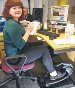  ?? Picture: Andy Jones FM4634368 ?? Reporter Natalie using the exercise machine at her desk