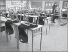  ?? The Canadian Press ?? A cleaner helps clean a classroom at Eric Hamber Secondary school in Vancouver, B.C.