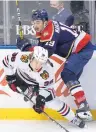  ?? PHOTO/WILFREDO LEE AP ?? Chicago Blackhawks left wing Brandon Hagel (38) and Florida Panthers left wing Mason Marchment vie for the puck during Saturday’s game.