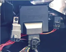  ??  ?? 12
The master fuse (which connects directly to the battery, along with the main ground wire) and the relay were mounted next to the ECU and the wiring harness was plugged in. It is important that the power and ground go directly to the battery, not to the starter solenoid or other power points to isolate EMI noise that can interrupt some of the signals.