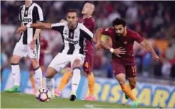  ??  ?? ROME: Roma’s midfielder from Egypt Mohamed Salah (right) vies with Juventus’ midfielder from Germany Sami Khedira during the Italian Serie A football match Roma vs Juventus on Sunday at the Olympic stadium. — AFP