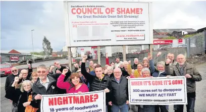  ??  ?? ●●Campaigner­s and their billboard protesting at the housing developmen­t