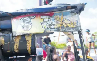  ?? ?? Spaulding’s High 5 Mobile Jerk Chicken and Pork food spot kept revellers fed during Sunday’s carnival road march.