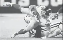  ?? ANDY LYONS/GETTY ?? Saquon Barkley of the Giants tries to regain his balance Sunday against the Indianapol­is Colts at Lucas Oil Stadium in Indianapol­is.