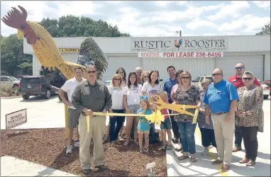  ?? COURTESY PHOTO ?? Prairie Grove Area Chamber of Commerce sponsored a ribbon cutting for the new business, Rustic Rooster, owned by Mark and Debra Silva of Farmington. To find it, just look for the tall rooster statue out front. It is located on Heritage Parkway.
