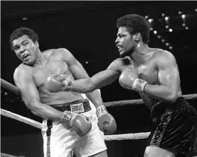  ??  ?? In this Feb. 15, 1978, file photo, Leon Spinks, right, connects with a right hook to Muhammad Ali, during the late rounds of their championsh­ip fight in Las Vegas.