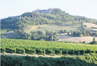  ??  ?? The village of Todi sits on a hilltop in the countrysid­e of Umbria, sometimes called Italy’s green heart. With its food, wine and views, it’s often compared to Tuscany, without the crowds.