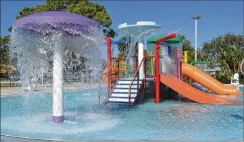  ?? CONTRIBUTE­D BY PALM BEACH GARDENS ?? Palm Beach Gardens’ Splash Zone will reopen March 17. The playground equipment is refurbishe­d and repainted, and the city added a new slide.