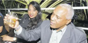  ??  ?? ttech Limited CEO Christophe­r Reckord examined the amber colour and legs of the Johnnie Walker Gold Label Reserve while Ellisse Campbell, head of marketing National Baking Company Ltd, looked on.