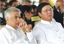  ??  ?? HAMBANTOTA: Sri Lankan Prime Minister Ranil Wickremesi­nghe (left) and Chinese ambassador Yi Xianliang look on during the opening ceremony of an industrial zone project in the southern port city of Hambantota yesterday. —AFP