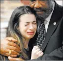  ?? Gerald Herbert ?? The Associated Press Aria Siccone, 14, a 9th grade survivor from Marjory Stoneman Douglas High School, cries Wednesday as she recounts her story while Florida state Rep. Barrinton Russell, D-distict 95, comforts her.