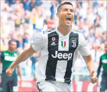  ??  ?? Cristiano Ronaldo celebrates after scoring his first goal for Juventus, during their Serie A match against Sassuolo on Sunday.