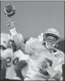  ?? Associated Press photo ?? LSU quarterbac­k Joe Burrow runs through drills during an NCAA college football practice in Baton Rouge, La. earlier this month.