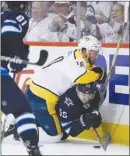  ?? The Canadian Press ?? Colton Sissons of the Nashville Predators knocks down Winnipeg Jets’ Mark Scheifele during Game 6 in Winnipeg on Monday.