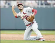  ?? Associated Press ?? St. Louis Cardinals third baseman Nolan Arenado throws to first for the out on the Kansas City Royals’ Samad Taylor during the third inning of a baseball game, Aug. 12, in Kansas City, Mo. Arenado was not among the three NL Gold Glove finalists announced Wednesday, ending his 10-year streak of winning the award at third base. Pittsburgh’s Ke’Bryan Hayes, Colorado’s Ryan McMahon and Atlanta’s Austin Riley are contending for the award, which will be announced Nov. 5.